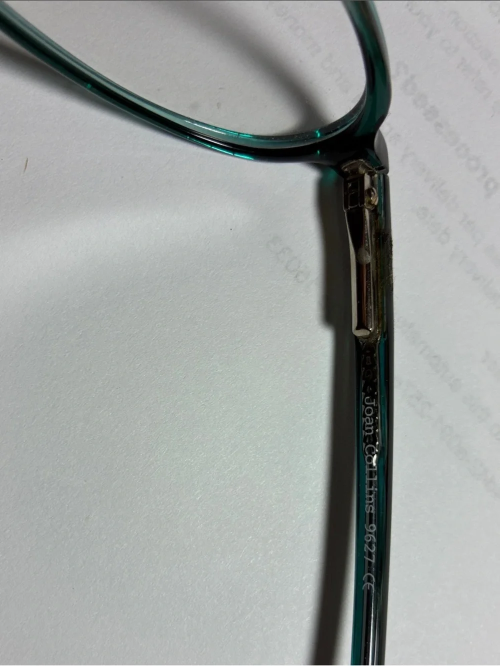 Joan collins teal oval